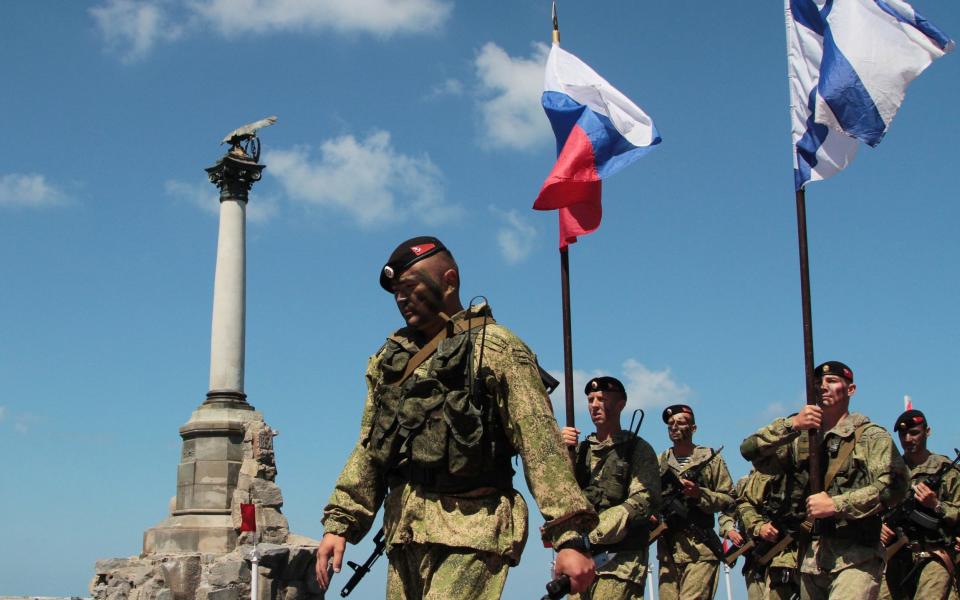 Russian servicemen take part in the Navy Day celebrations in the Black Sea port of Sevastopol - Credit: REUTERS/Pavel Rebrov