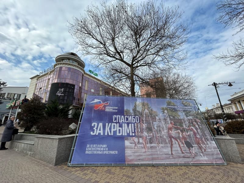 A billboard in the city centre of Crimea's capital Simferopol with the inscription "Thank you for Crimea" commemorates the 10th anniversary of Russia's illegal annexation of the Black Sea peninsula, which is internationally recognized as part of Ukraine. According to the billboard, 410 public squares have been prepared for the citizens of the city over the past 10 years. Ulf Mauder/dpa