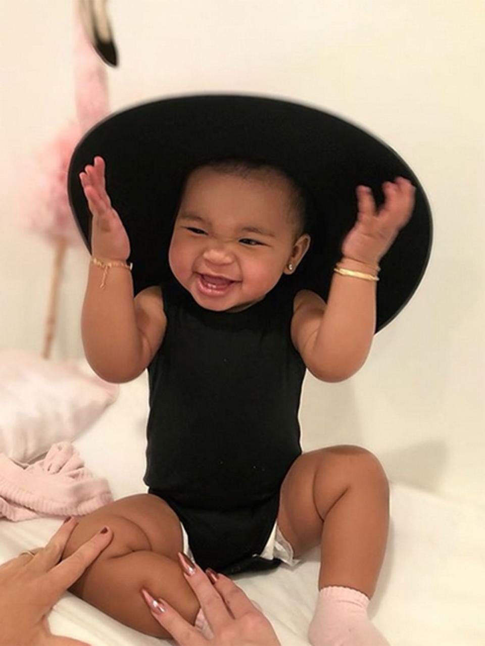 Khloé can't get enough of her baby girl's smile, and neither can we! "My entire heart," she captioned an <a href="https://www.instagram.com/p/Bt6OnogllR6/" rel="nofollow noopener" target="_blank" data-ylk="slk:Instagram photo;elm:context_link;itc:0;sec:content-canvas" class="link ">Instagram photo</a> of True looking chic in a black onesie and oversized hat. 