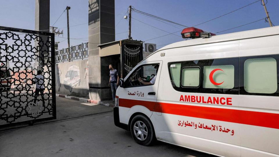 PHOTO: Palestinian health ministry ambulances cross the gate to enter the Rafah border crossing in the southern Gaza Strip before crossing into Egypt on November 1, 2023. (Mohammed Abed/AFP via Getty Images)