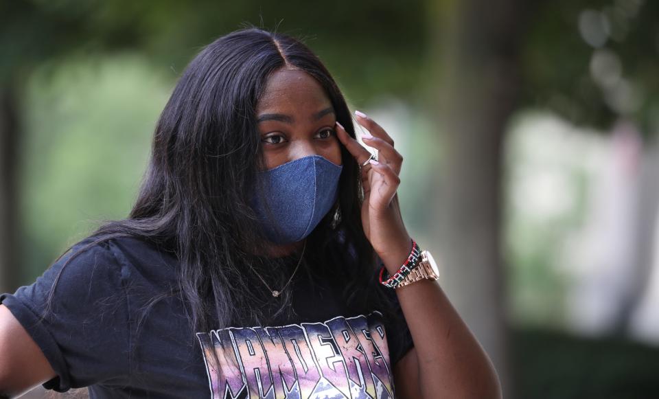 Koko Chaumia, of Malawi, heads into the Susan B. Anthony Residence Halls during the annual move-in day for incoming students at the University of Rochester.