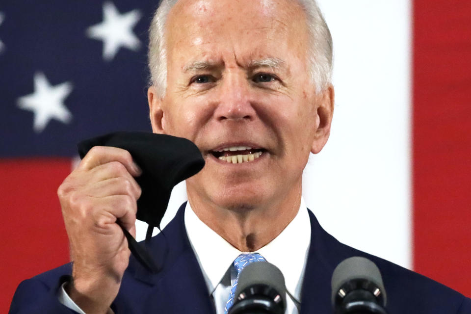 WILMINGTON, DELAWARE - JUNE 30:   Democratic presidential candidate, former Vice President Joe Biden holds up a mask as he speaks during a campaign event June 30, 2020 at Alexis I. Dupont High School in Wilmington, Delaware. Biden discussed the Trump Administration’s handling of the COVID-19 pandemic.  (Photo by Alex Wong/Getty Images)