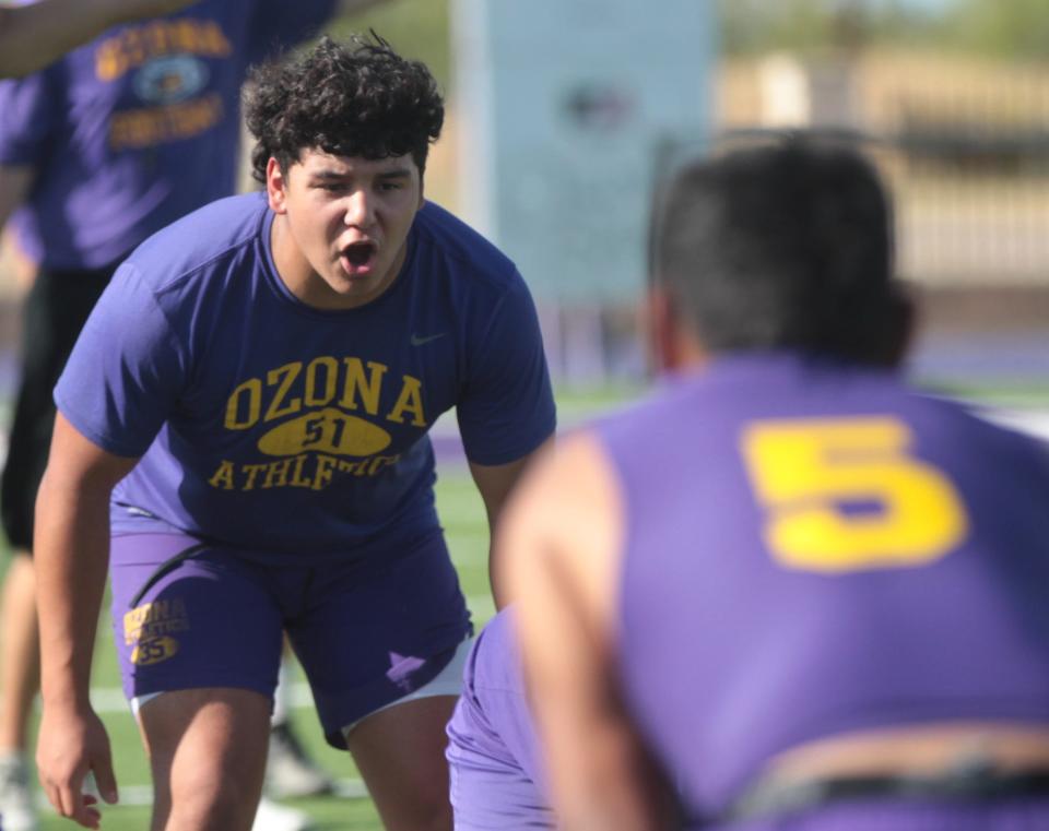 Ozona High School's Bernie Blanco yells out coverage information during a defensive drill at workout Monday, Aug. 1, 2022, at Lion Stadium in Ozona.
