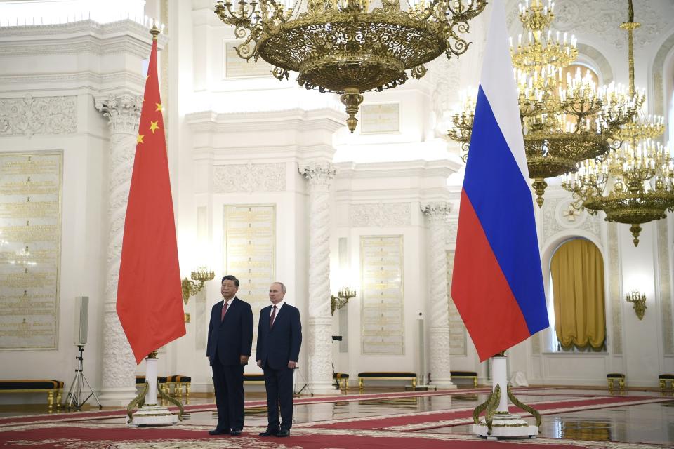 FILE - Russian President Vladimir Putin, right, and Chinese President Xi Jinping attend an official welcome ceremony at The Grand Kremlin Palace, in Moscow, Russia, March 21, 2023. China’s leader Xi just concluded his three-day visit with Russian President Putin, a warm affair in which the two men praised each other and spoke of a profound friendship. It’s a high in a complicated, centuries-long relationship in which the two countries have been allies and enemies.(Alexey Maishev, Sputnik, Kremlin Pool Photo via AP, File)