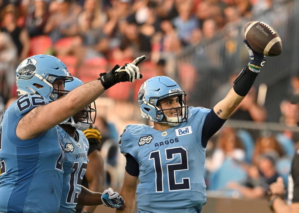 Toronto Argonauts quarterback Chad Kelly (12) celebrates after scoring a touchdown against the Hamilton Tiger-Cats during a game on June 18, 2023.