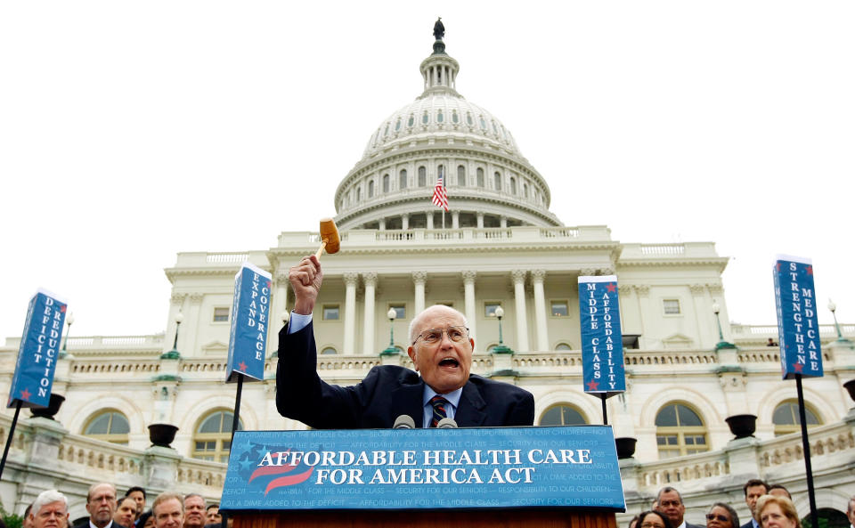 Dingell wields the gavel used when he chaired the committee that passed Medicare legislation in 1965 during an event unveiling the Affordable Care Act on Oct. 29, 2009, in Washington, D.C.