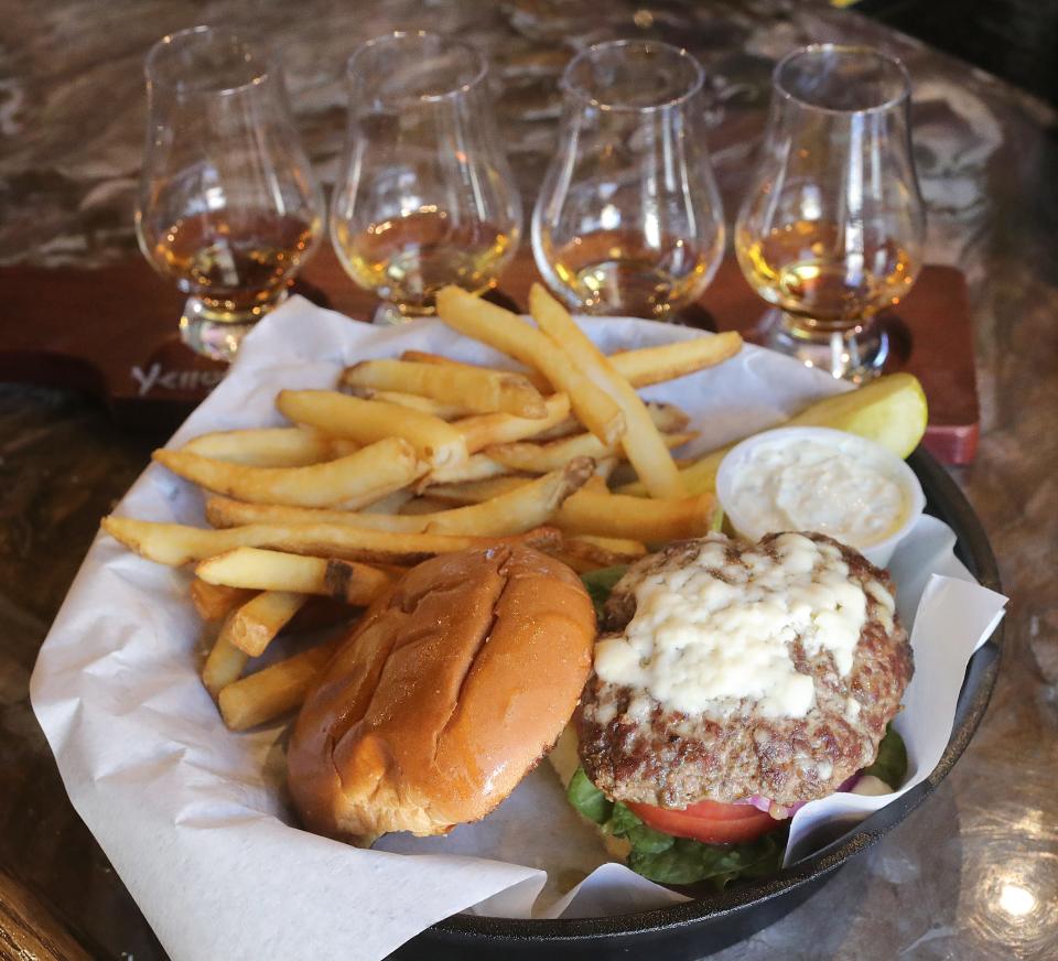 A whiskey flight and a $14 Little Bo Peep lamb burger at Perfect Pour June 28 in Akron.