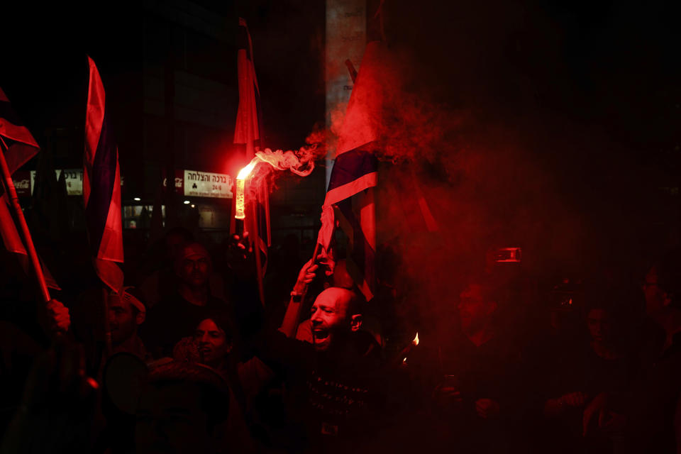 FILE - Secular Israelis protest against plans by Prime Minister Benjamin Netanyahu's government to overhaul the judicial system in the ultra-Orthodox city of Bnei Brak near Tel Aviv, Israel, Thursday, March 23, 2023. With ultra-Orthodox parties now wielding unprecedented power and playing a key role in a contentious plan to overhaul the legal system, they are aggravating concerns among secular Israelis that the character and future of their country is under threat. (AP Photo/Ariel Schalit, File)