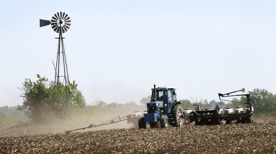 Andy Hall plants corn in a field, Thursday, May 10, 2012, near Bondurant, Iowa. The U.S. Department of Agriculture estimates a record corn crop this year, topping the previous high by 11 percent.(AP Photo/Charlie Neibergall)