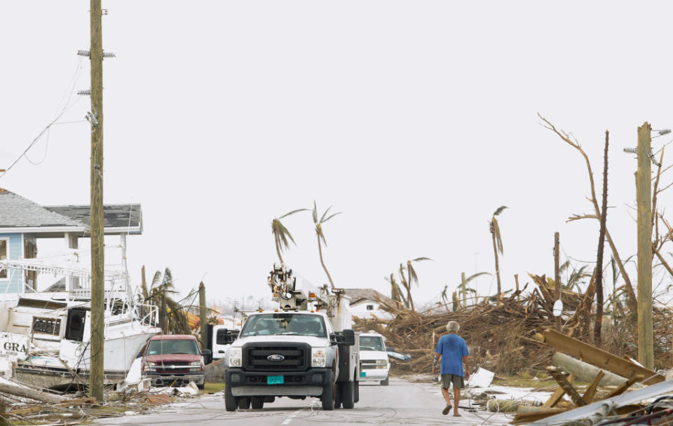 A power authority truck parks near downed wires on devastated Great Abaco Island on Sept. 6, 2019 in the Bahamas. | Jose Jimenez—Getty Images