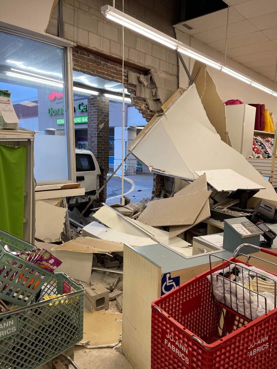 A vehicle crashed into the JOANN Fabric building at 3332 Division St. W in St. Cloud Friday, Nov. 11, 2022. The driver was injured but no one else was hurt, according to the St. Cloud Police Department.