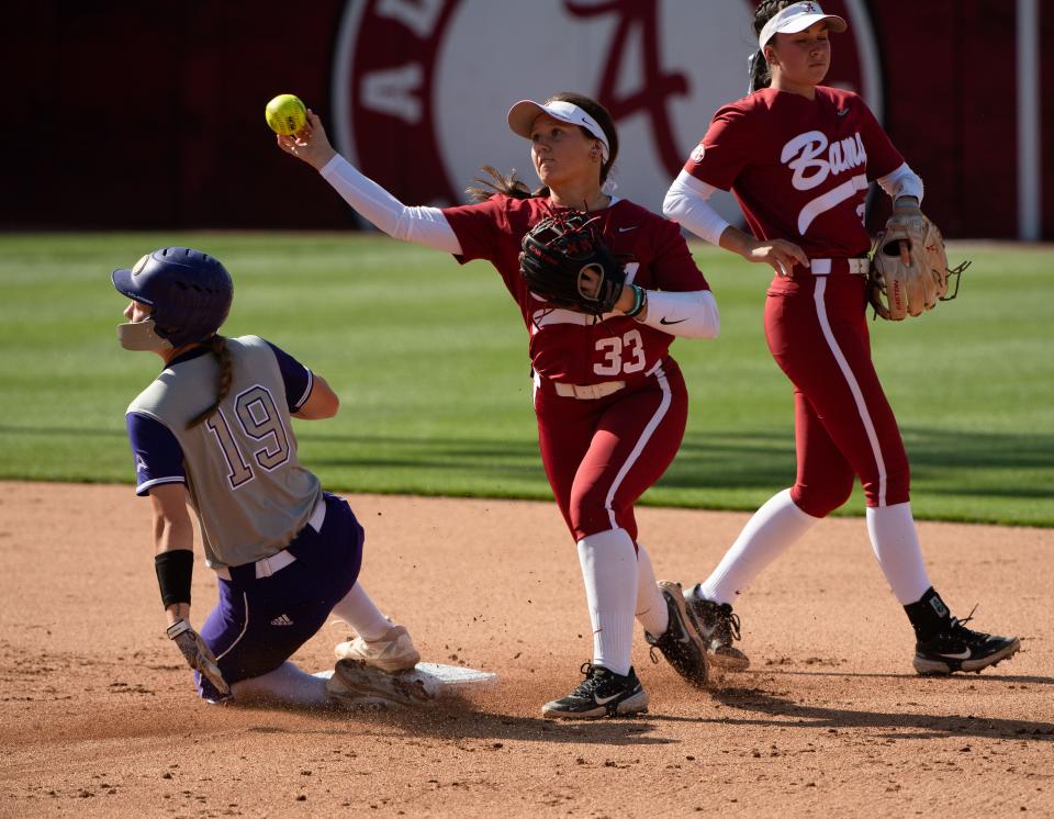 Alabama second baseman Megan Bloodworth makes the turn after forcing UNA base runner Harley Stokes at second during the game against UNA Tuesday, April 20, 2022, at Rhoads Stadium. Gary Cosby Jr./Tuscaloosa News