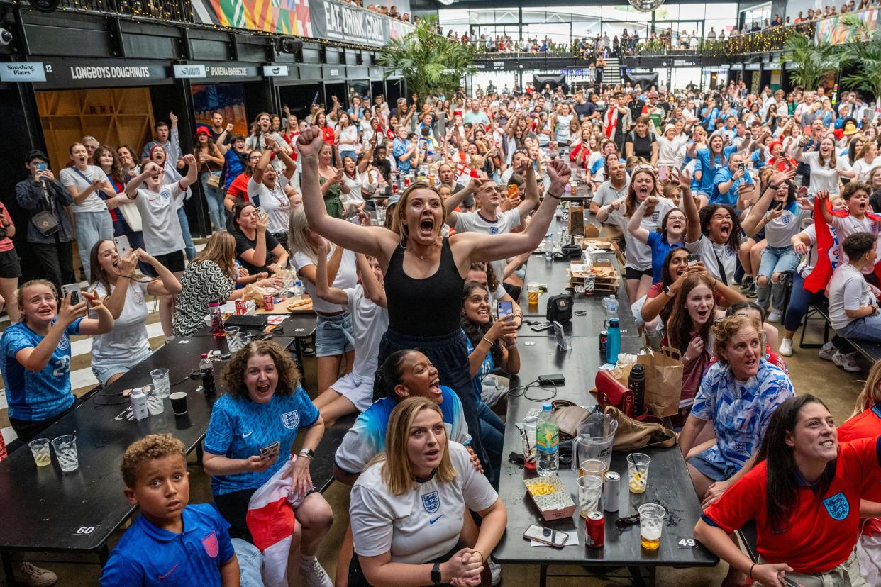 London, UK.  16 August 2023.  England fans at BOXPARK Wembley Park celebrate victory watching the live broadcast on the big screen of England’s semi-final match against Australia in the FIFA Women’s World Cup 2023, which is being played in Australia and New Zealand. Final score Australia 1 England 3. Credit: Stephen Chung / Alamy Live News