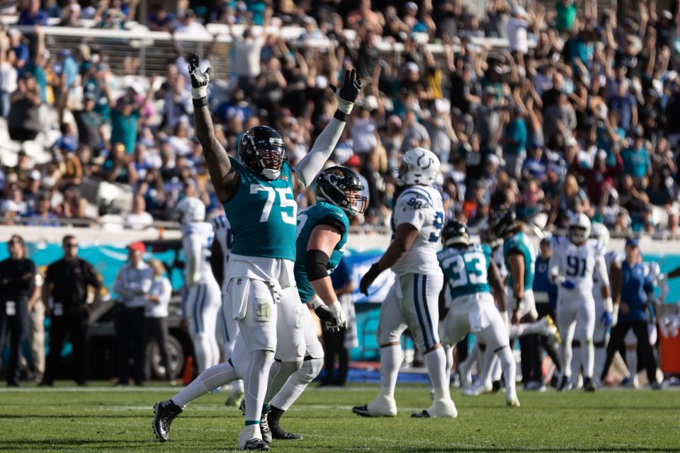 Jacksonville Jaguars offensive tackle Jawaan Taylor (75) celebrates after a touchdown against the Indianapolis Colts at TIAA Bank Field on Jan. 9, 2022. His father unexpectedly died just nine days later.