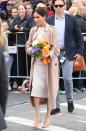 <p>Re- wearing her nude-coloured suede <a href="https://www.stuartweitzman.com/products/legend/" rel="nofollow noopener" target="_blank" data-ylk="slk:Stuart Weitzman 'Legend' pumps;elm:context_link;itc:0;sec:content-canvas" class="link ">Stuart Weitzman 'Legend' pumps</a>, Markle wore another trench, and a custom <a href="https://www.net-a-porter.com/gb/en/Shop/Designers/Brandon_Maxwell?pn=1&npp=60&image_view=product&dScroll=0" rel="nofollow noopener" target="_blank" data-ylk="slk:Brandon Maxwell;elm:context_link;itc:0;sec:content-canvas" class="link ">Brandon Maxwell</a> cream shift dress.</p>