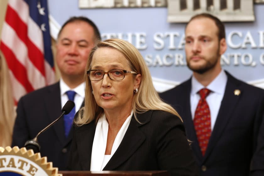 San Joaquin County District Attorney Tori Salazar discusses her support of a proposed measure that would seal past arrest records and convictions of lower-level felonies and misdemeanors, during a news conference in Sacramento, Calif., Monday, Feb. 24, 2020. If approved by the legislature and signed by the governor the bill, by Assemblyman Phil Ting, D-San Francisco, left, would automatically clear eligible records dating back to 1973. Supporters say the bill to seal past arrest histories would help lower the barriers to finding work or housing. At right is San Francisco District Attorney Chesa Boudin who also spoke in support of the bill. (AP Photo/Rich Pedroncelli)