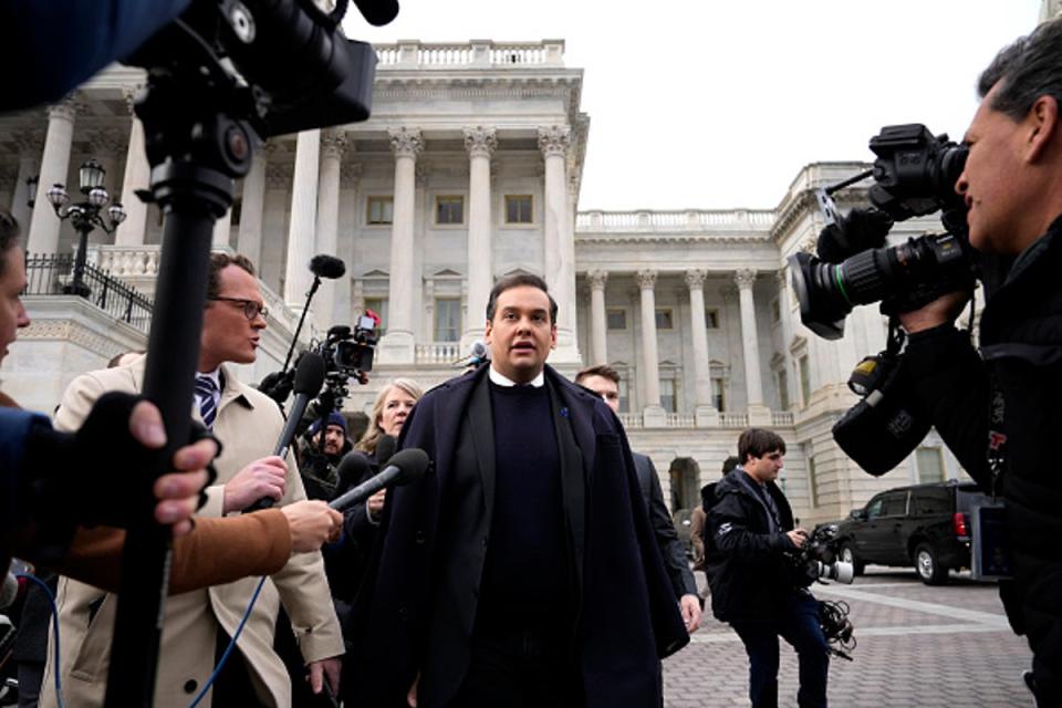 Rep. George Santos (R-NY) is surrounded by journalists as he leaves the U.S. Capitol after his fellow members of Congress voted to expel him from the House of Representatives on December 01, 2023 in Washington, DC. (Getty Images)