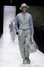 A model wears a creation as part of the Giorgio Armani Men's Spring Summer 2025 collection, that was presented in Milan, Italy, Monday, June 17, 2024. (AP Photo/Luca Bruno).