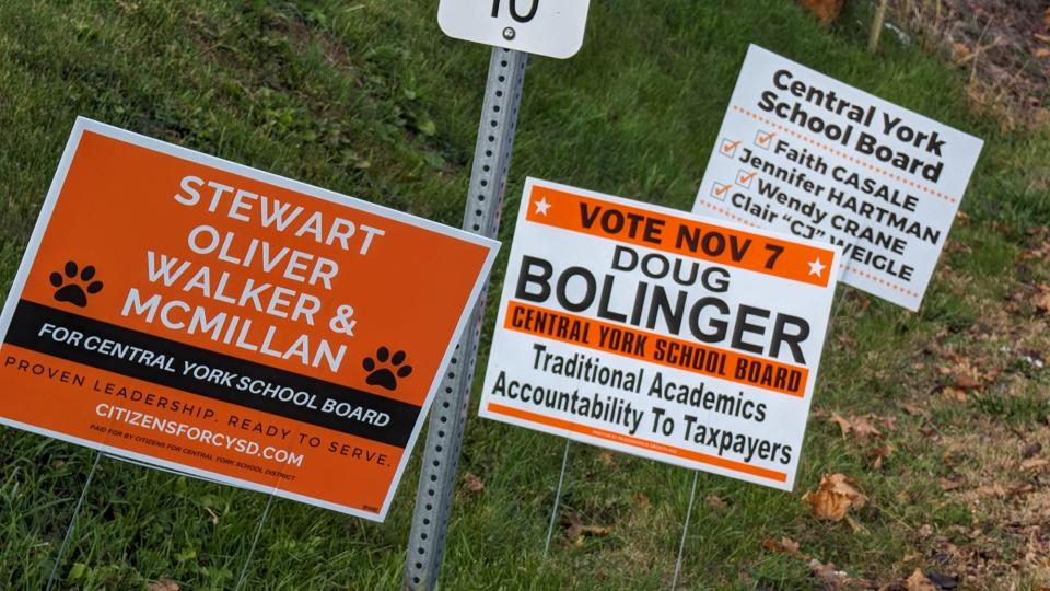 Competing signs for the Central York School District In Manchester Township on November 4, 2023.
