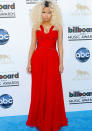 Best dressed: Nicki Minaj looked demure in a red gown nipped in at the waist.