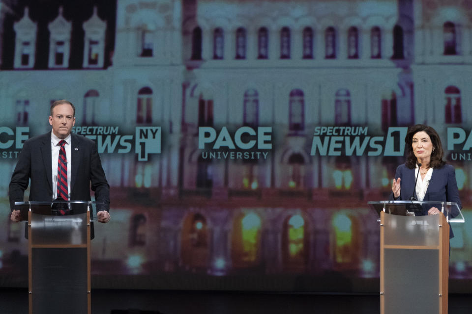 Republican candidate for New York Governor Lee Zeldin, left, participates in a debate against incumbent Democratic Gov. Kathy Hochul hosted by Spectrum News NY1, Tuesday, Oct. 25, 2022, at Pace University in New York. (AP Photo/Mary Altaffer, Pool)