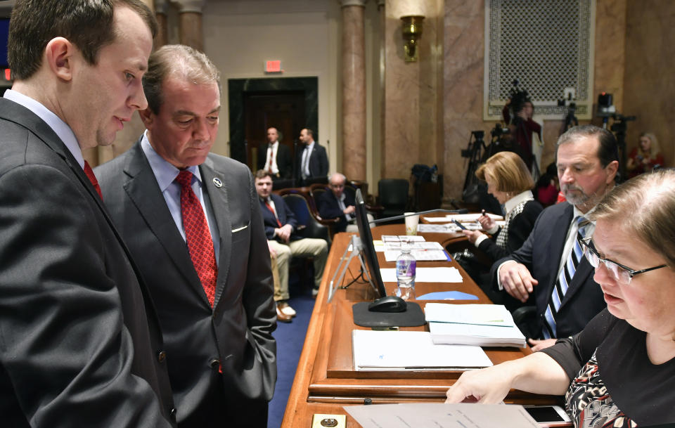 House Majority Floor Leader Jonathan Shell, R-Lancaster, left, and Kentucky Speaker of The House David Osborne, R-Prospect, talk Melissa Bybee-Fields, Chief Clerk of the House of Representatives during the opening of the special session at the Kentucky state Capitol in Frankfort, Ky., Monday, Dec. 17, 2018. (AP Photo/Timothy D. Easley)