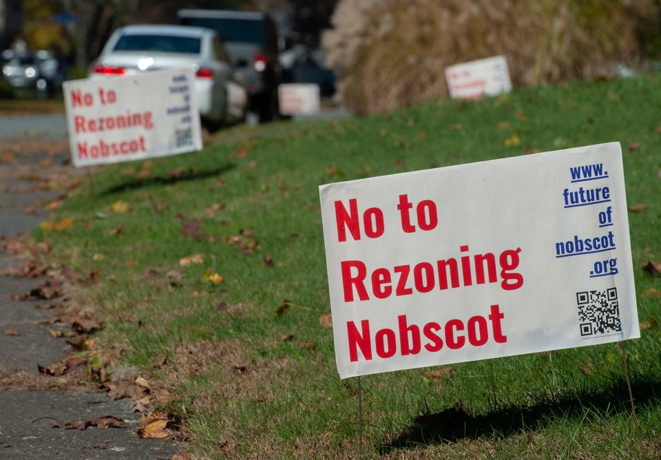 These signs have popped up along several streets in Framingham's Nobscot neighborhood, in response to a petition made last year to rezone 39 acres of land and accommodate a mixed-use development. While the petition was withdrawn earlier this year, several residents have organized to make clear to city officials that they oppose any effort to rezone the land from its current residential status.