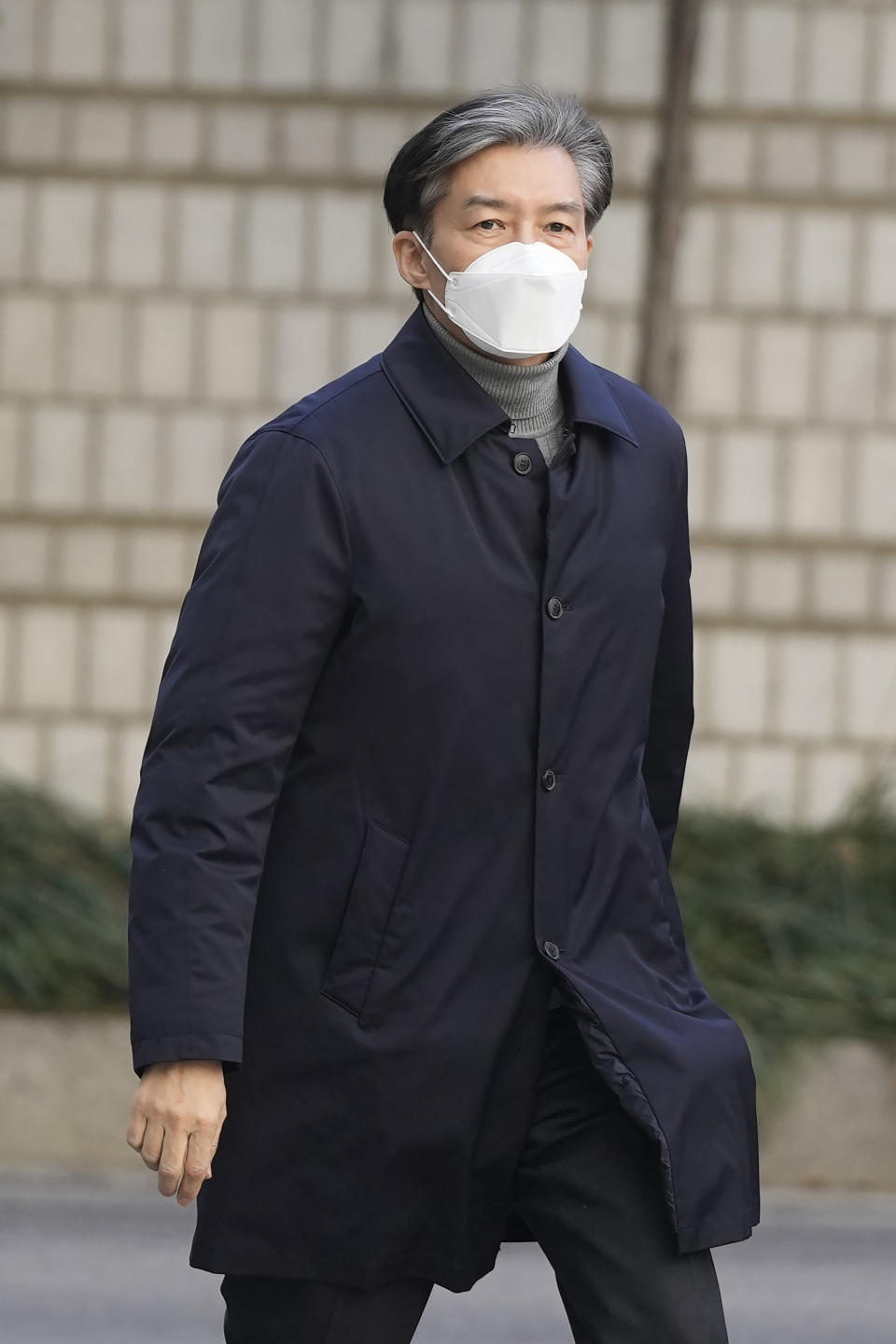 Former Justice Minister Cho Kuk arrives at the Seoul Central District Court in Seoul, South Korea, Friday, Feb. 3, 2023. The court on Friday sentenced Cho to two years in prison, after he was found guilty of creating fake credentials to help his children get into prestigious schools, a scandal that rocked the country’s previous government and sparked huge protests. (AP Photo/Lee Jin-man)