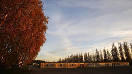 Barracks are seen at dawn at the former concentration camp in Dachau near Munich November 3, 2014. A door at the main gate with the Nazi slogan "Arbeit macht frei" (work sets you free) was stolen on November 2, 2014. REUTERS/Michael Dalder