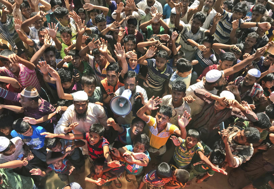 FILE - In this Nov. 15, 2018, file photo, Rohingya refugees shout slogans against repatriation at Unchiprang camp near Cox's Bazar, in Bangladesh. Myanmar and Bangladesh are making a second attempt to start repatriating Rohingya Muslims after more than 700,000 of them fled a security crackdown in Myanmar almost two years ago, the U.N. refugee agency said Friday, Aug. 16, 2019. (AP Photo/Dar Yasin, File)