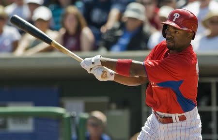 Philadelphia Phillies' Jimmy Rollins singles off New York Yankees starter Adam Warren during the first inning of a MLB spring training baseball game in Clearwater, Florida, March 19, 2013. REUTERS/Steve Nesius