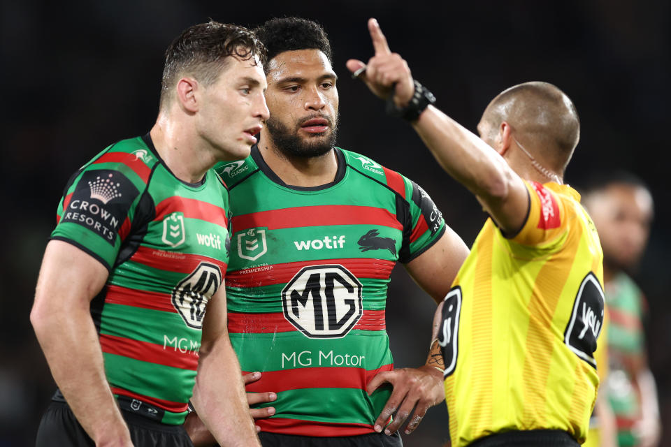 Taane Milne (pictured middle) is sent off the field during the NRL Preliminary Final match.