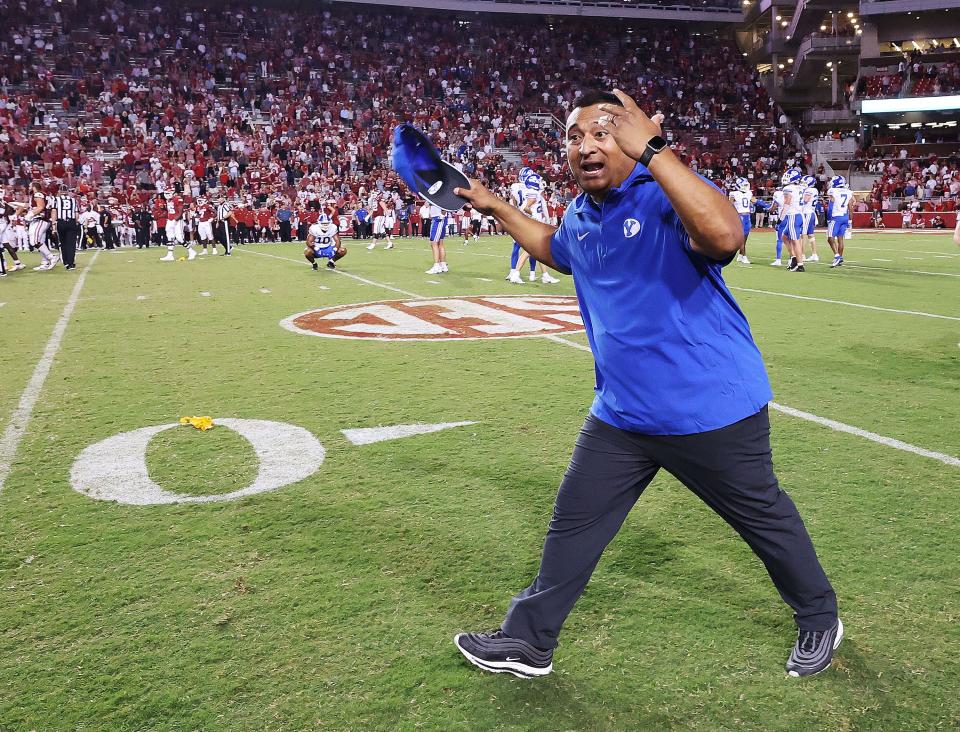 BYU head coach Kalani Sitake celebrates the Cougars’ win over Arkansas at Razorback Stadium in Fayetteville on Saturday, Sept. 16, 2023. Next up for BYU is at Kansas in the Big 12 opener this Saturday. | Jeffrey D. Allred, Deseret News