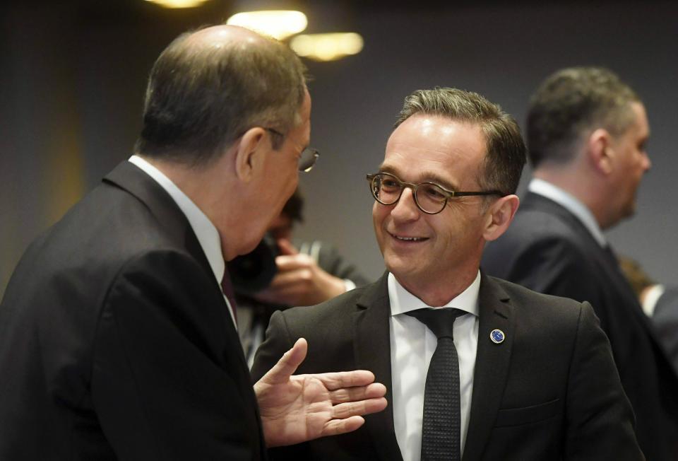 Minister of Foreign Affairs of Russia Sergei Lavrov, left, speaks with German Foreign Minister Heiko Maas at the ministers for foreign affairs of the Council of Europe's annual meeting in Helsinki, Finland, Friday May 17, 2019. (Vesa Moilanen/Lehtikuva via AP)