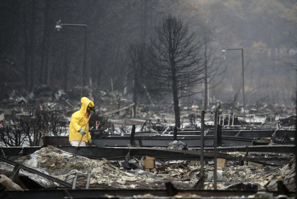 A search and rescue crew member searches for human remains at a mobile home park that was destroyed by the Camp Fire in California last month.&nbsp; (Photo: Justin Sullivan via Getty Images)