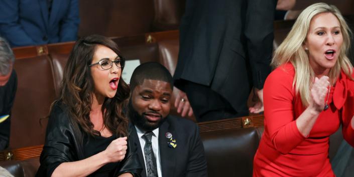 Rep. Lauren Boebert, R-Colo., left, and Rep. Marjorie Taylor Greene, R-Ga., right, scream &quot;Build the Wall&quot; as President Joe Biden delivers his first State of the Union address to a joint session of Congress at the Capitol, Tuesday, March 1, 2022, in Washington