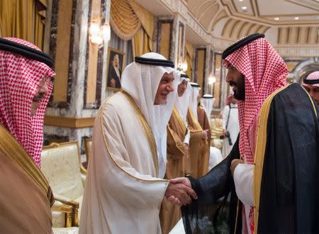 Saudi Arabia's Crown Prince Mohammed bin Salman (R) shakes hands with a member of the royal family during an allegiance pledging ceremony in Mecca, Saudi Arabia June 21, 2017. Bandar Algaloud/Courtesy of Saudi Royal Court/Handout via REUTERS