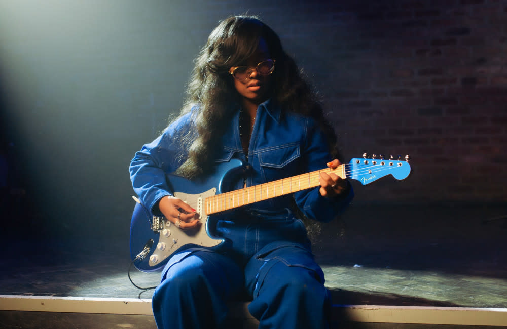 H.E.R. pays tribute to her musician father Kenny Wilson with her limited edition Fender Strat credit:Bang Showbiz