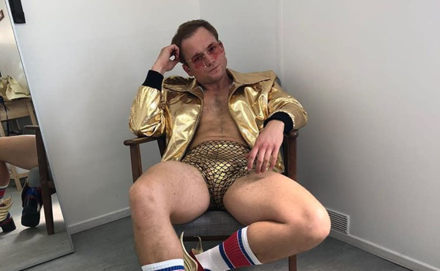 Taron Egerton donned gold hot pants to celebrate the birthday of singer Elton John, who the actor portrays in upcoming biopic ‘Rocketman’. (Credit: Instagram/Taron Egerton)