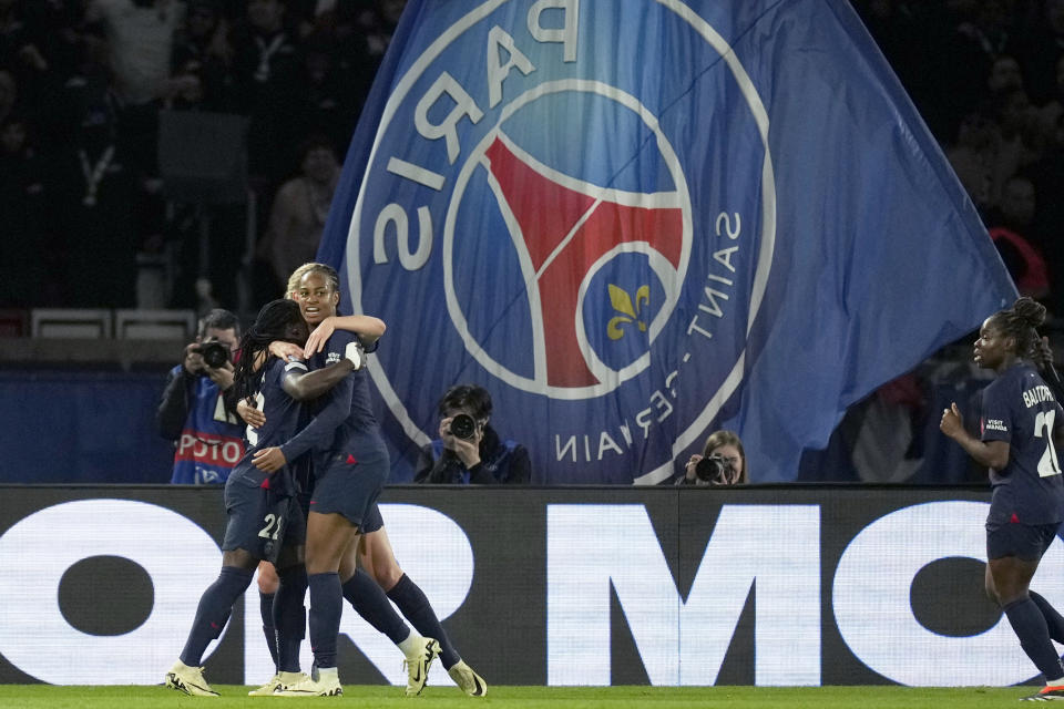 PSG's Tabitha Chawinga, left, celebrates with her teammates after scoring the opening goal during the women's Champions League quarterfinals, second leg, soccer match between Paris Saint-Germain and BK Hacken at Parc des Princes, in Paris, Thursday, March 28, 2024. (AP Photo/Thibault Camus)