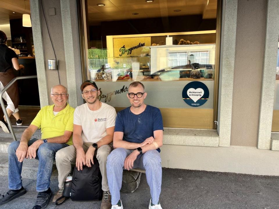 The author, center, with Albert Baggenstoss, III, left, and his son Albert Baggenstoss, IV, at right, at the Baggenstoss Bakery in Richterswil, near Zurich, Switzerland.