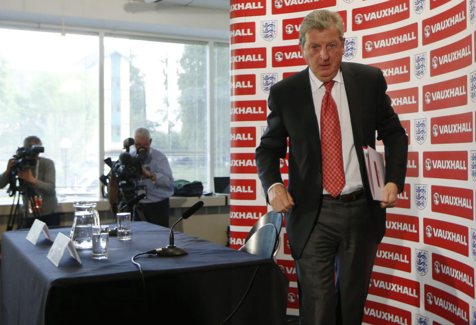 England's soccer manager Roy Hodgson leaves, after announcing the squad for the World Cup in Brazil at Vauxhall headquarters, in Luton, England, Monday, May 12, 2014. England coach Roy Hodgson selected a World Cup squad containing several young players on Monday, although Frank Lampard was among the veterans to still make the cut. (AP Photo/Sang Tan)