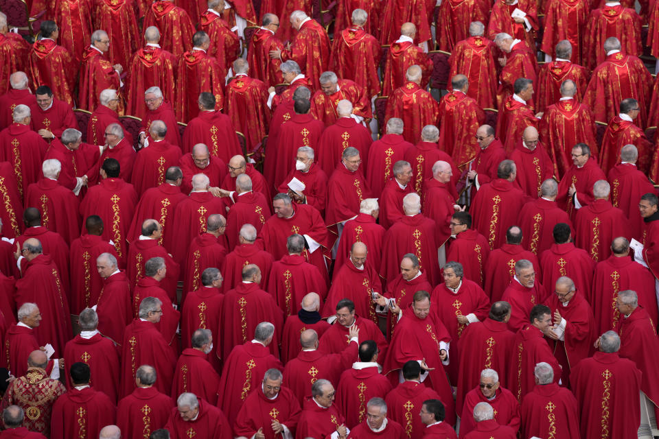 Members of the church chat while waiting for the start of the funeral mass for late Pope Emeritus Benedict XVI in St. Peter's Square at the Vatican, Thursday, Jan. 5, 2023. Benedict died at 95 on Dec. 31 in the monastery on the Vatican grounds where he had spent nearly all of his decade in retirement. (AP Photo/Ben Curtis)