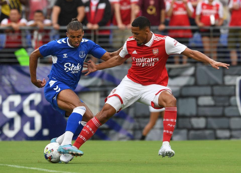 William Saliba #12 of Arsenal and Dominic Calvert-Lewin #9 of Everton go after the ball in the first half during a preseason friendly at M&T Bank Stadium on July 16, 2022 (Arsenal FC via Getty Images)