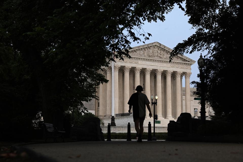 A pedestrian is seen close to the Supreme Court on June 5, 2023.
