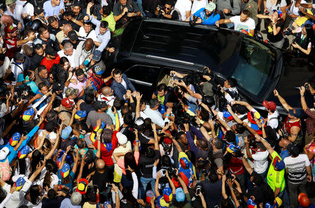 Venezuelan opposition leader and self-proclaimed interim president Juan Guaido is greeted by supporters as he leaves a rally against Venezuelan President Nicolas Maduro's government in Caracas, Venezuela February 2, 2019. REUTERS/Adriana Loureiro