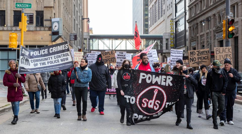 Members of different organizations march together along North Water Street in Milwaukee Saturday, Nov. 20, 2021, in response to the Kyle Rittenhouse verdicts.