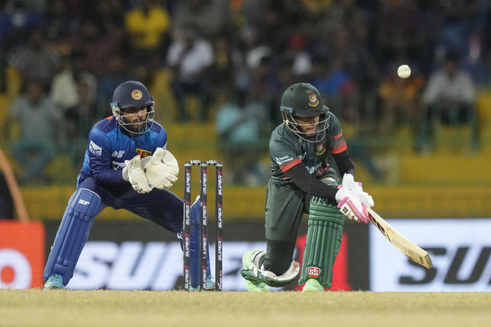 Bangladeshes' Mushfiqur Rahim plays a shot as Sri Lankan wicketkeeper Kusal Mendis watches during the Asia Cup cricket match between Sri Lanka and Bangladesh in Colombo, Sri Lanka, Saturday, Sept. 9, 2023. (AP Photo/Eranga Jayawardena)