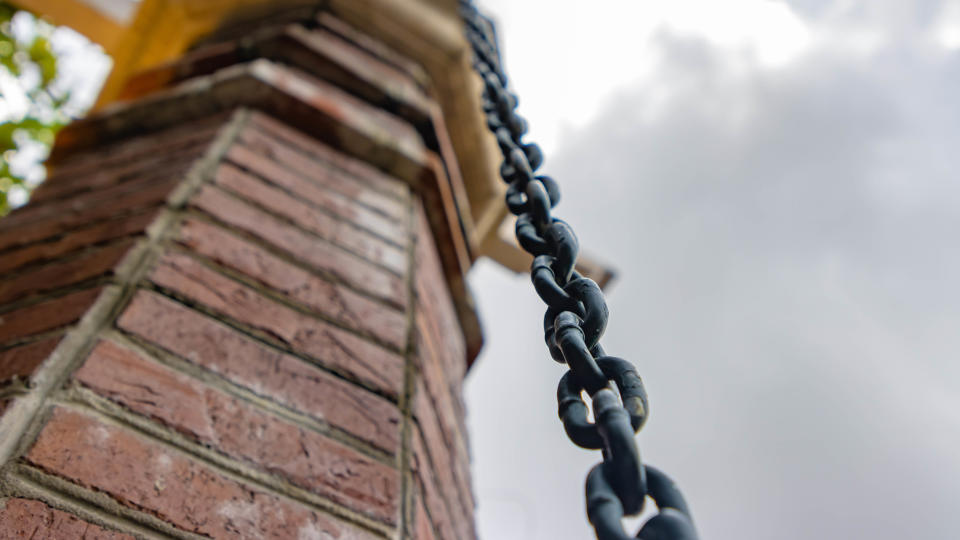 A rain chain hanging outside