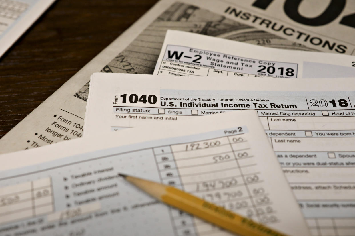 U.S. Department of the Treasury Internal Revenue Service (IRS) 1040 Individual Income Tax forms for the 2018 tax year are arranged for a photograph in Tiskilwa, Illinois, U.S., on Monday, March 11, 2019. Fewer people are getting refunds this year and that's causing angst for Republicans who want to convince voters that the 2017 tax overhaul really did give them a tax cut. Photographer: Daniel Acker/Bloomberg via Getty Images